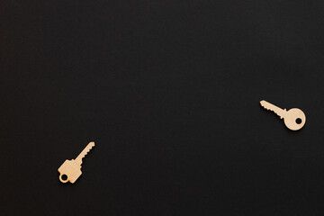 Wooden keys .Composition on black background.