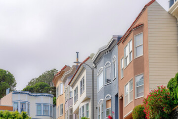 Fototapeta na wymiar Row of suburban houses in a low angle view at San Francisco, California