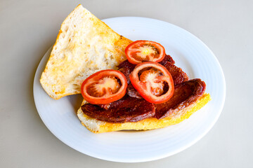 Grilled chili, tomato and sucuk between bread. ( Sucuk ekmek ) 