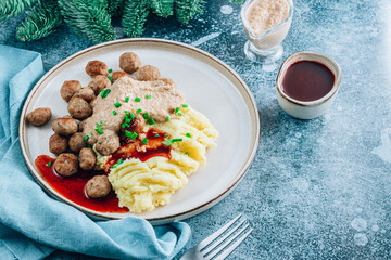 Swedish meatballs kottbullar, mashed potato, onion sauce and lingonberry sauce.