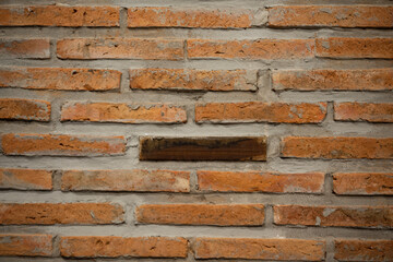 Brick wall background on construction site.Different wood square and red bricks background.Brick wall, abstract background texture and copy space.