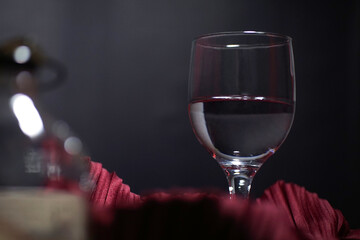 restaurant water glass in with red cloth and black background