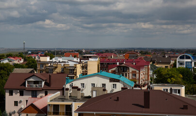 Fototapeta na wymiar View of the beautiful buildings from the Ferris wheel in the village of Vityazevo in summer