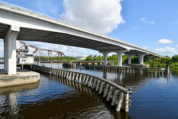 Old steel draw bridge and new concrete bridge over the St Johns river in Sanford, Florida off Lake Monroe. 