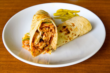 Lavash doner kebab ( zurna doner durum )  or shawarma sliced in plate isolated. 