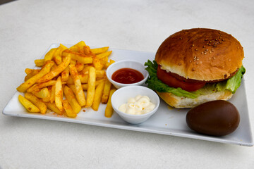Big tasty  burger with beef cutlet on a plate. Hamburger.