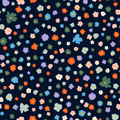 Cute little flower heads seamless repeat pattern. Random placed, vector calico ditsy all over surface print on black background.