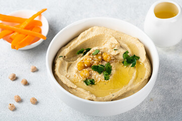 Hummus with carrot. Healthy snack. Vegetarian food. Chickpea hummus.