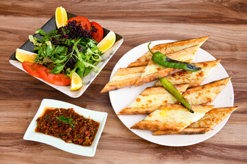 Turkish pita with minced cubed meat and cheese (Turkish name: Kiyma Kusbasi kasarli pide)