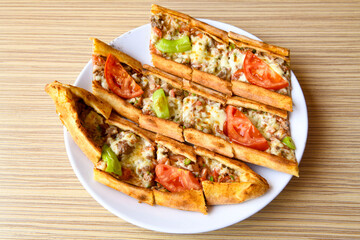 Turkish pita with minced cubed meat and cheese (Turkish name: Kiyma Kusbasi kasarli pide)