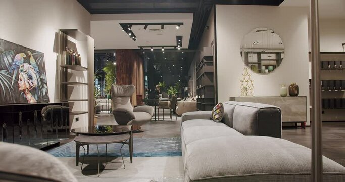 Modern Gray fabric sofa and Armchair. Textile upholstery sofa with pillows. Modern and Loft Apartment, Beautiful white sofa in the modern living room. Modern Sofa in Home. Scandinavian interior.