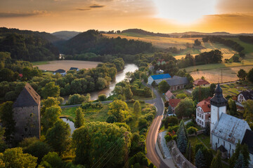 Historical Siedlecin town illuminated by the setting sun in the Bobr Valley Landscape Park, Lower Silesia. Poland © Patryk Kosmider
