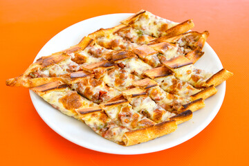 Turkish pita with minced cubed meat and cheese (Turkish name: Kiyma Kusbasi kasarli pide)