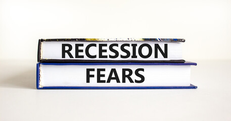 Recession fears symbol. Concept words Recession fears on books on a beautiful white table white background. Business and recession fears concept. Copy space.