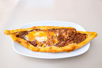 Turkish pita with minced cubed meat and cheese (Turkish name: Kiyma Kusbasi kasarli pide)