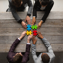 Business people assembling jigsaw puzzle