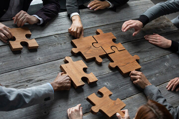 Business people team with puzzle - 521863712