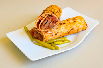 Grilled Turkish Adana, Urfa  Kebab with grilled vegetables, onion and rice on plate. Adana durum.