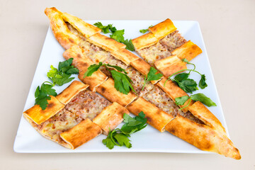 Turkish pita with minced cubed meat and cheese (Turkish name: Kiyma Kusbasi kasarli pide)