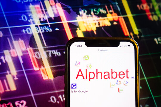 KONSKIE, POLAND - August 07, 2022: Smartphone displaying logo of Alphabet Inc American multinational technology conglomerate holding company on stock exchange chart background