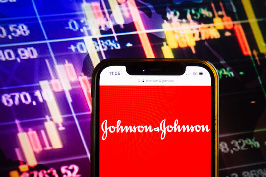 KONSKIE, POLAND - August 07, 2022: Smartphone displaying logo of Johnson and Johnson company on stock exchange chart background
