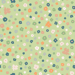 Cute little flowers seamless repeat pattern. Random placed, vector floral heads all over surface print on green background.