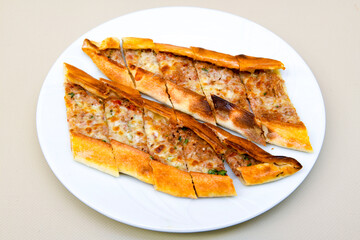 Turkish pita with minced cubed meat and cheese (Turkish name: Kiyma Kusbasi kasarli pide)
