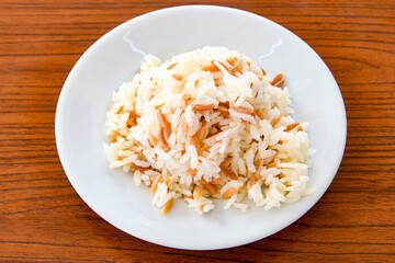 Traditional delicious Turkish food; Turkish style rice pilaf (Turkish name; Arpa sehriyeli. tavuklu, kuru fasulyeli, kavurmali pirinc pilavi)