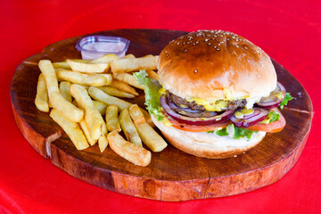 Big tasty burger with beef cutlet on a plate. Hamburger. Crispy chicken burger.