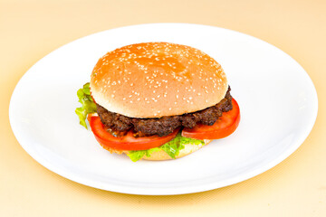 Big tasty  burger with beef cutlet on a plate. Hamburger.