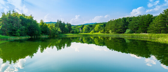 lake panorama with blue sky and white clouds