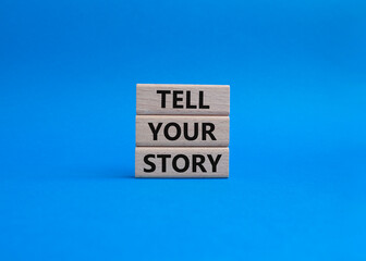 Tell your story symbol. Wooden blocks with words Tell your story. Beautiful blue background. Business and Tell your story concept. Copy space.