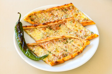 Turkish pita with minced cubed meat and cheese (Turkish name: Kiyma Kusbasi kasarli pide)