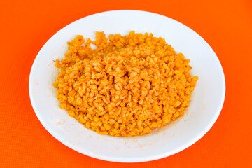 Traditional turkish bulgur pilaf with tomato sause in plate (Turkish name; bulgur pilavi, meyhane pilavi) Pirinc pilavi. Pilavustu tavuk, nohut, kuru fasulye, ciger.