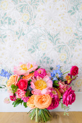 Floral arrangement on wallpaper