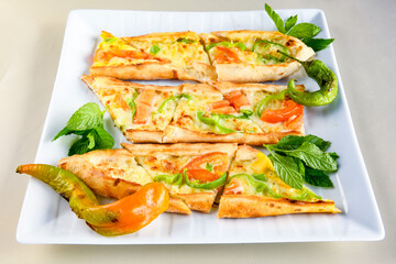 Turkish pita with minced cubed meat and cheese (Turkish name: Kiyma Kusbasi kasarli pide)