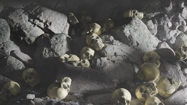 Many human skulls are lying on the rocks in the cave.