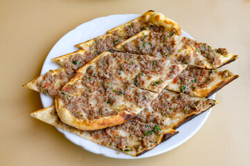Turkish pita with minced cubed meat and cheese (Turkish name: Kiyma Kusbasi kasarli pide)