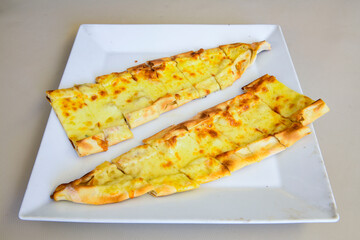Turkish pita with minced cubed meat and cheese (Turkish name: Kiyma Kusbasi kasarli pide)