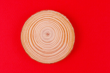 Round wooden frame on a red background