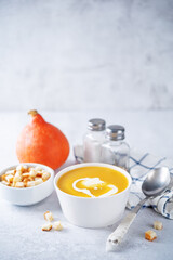 Pumpkin soup with cream in a bowl