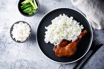 Peking duck with rice on a plate