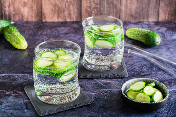 Cucumber mineral water in glasses on the table. Homemade antioxidant drinks
