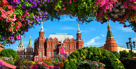 Flowers on Manezhnaya Square, Moscow, Russia. Historical Museum (it's written on roof) and Moscow...
