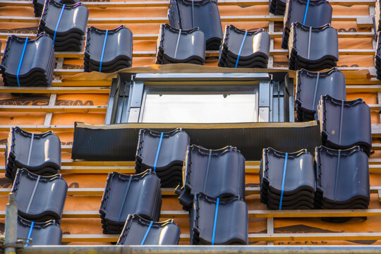 close up of a rooftop with roof tile packages, ready for being tiled, Rucphen, The Netherlands, 6 may, 2022