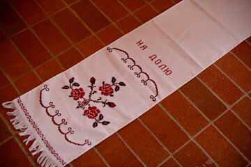 A Ukrainian wedding rushnyk with floral embroidery symbolizing good fortune.