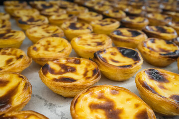 Traditional Portuguese dessert Pastle de Nata with custard on the counter