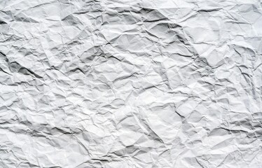 A horizontal sheet of heavily crumpled white paper as a background for placing text and images.