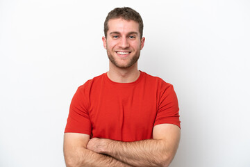 Obraz premium Young caucasian man isolated on white background keeping the arms crossed in frontal position