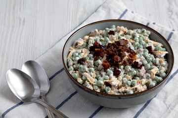 Homemade Creamy Bacon Pea Salad in a Bowl, side view.